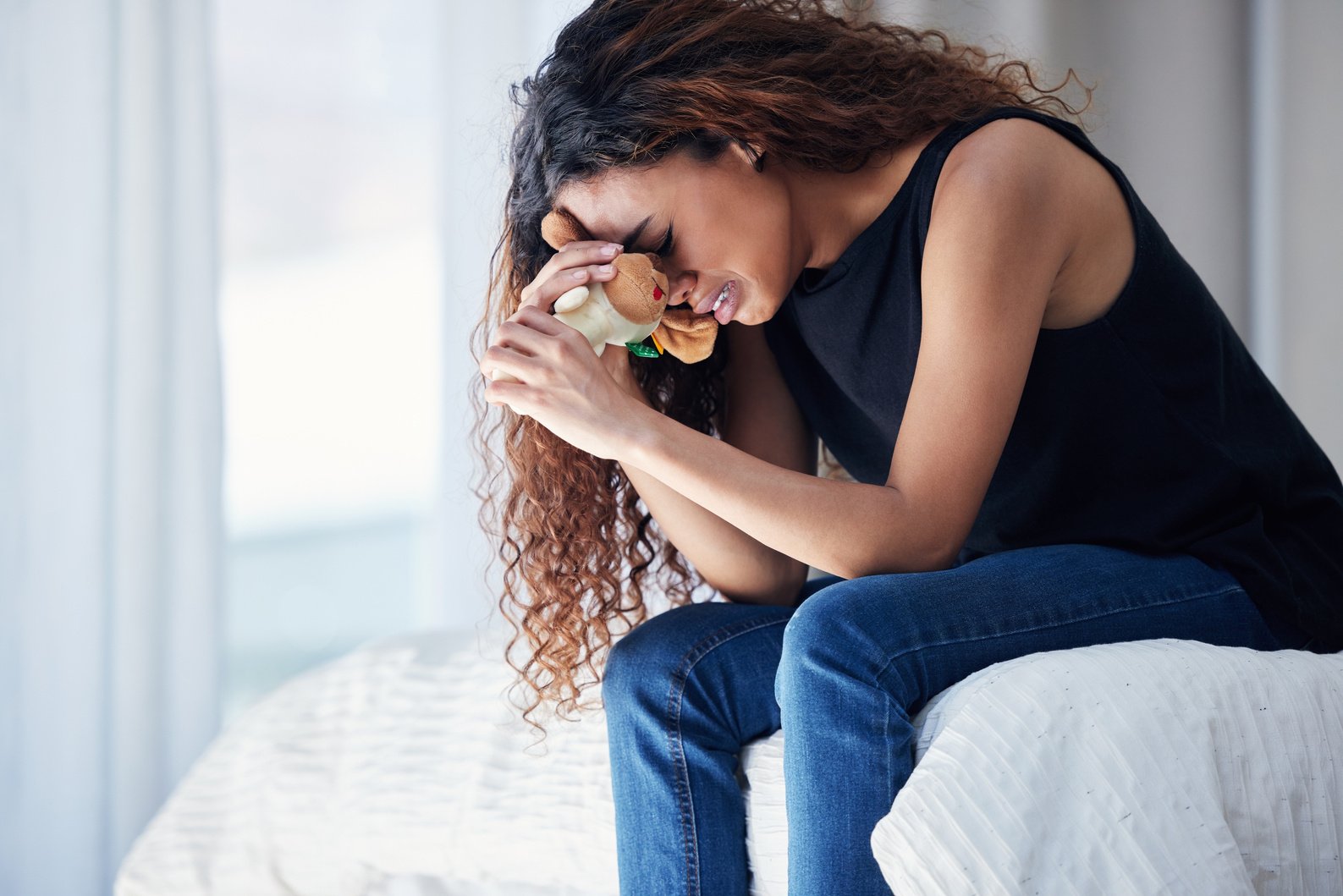 Crying, Depression and Woman with Teddy Bear on Bed for Grief, Miscarriage or Mourning Death of Kid. Sad Mother, Tears and Person in Bedroom with Pain, Anxiety or Trauma Problem, Stress or Frustrated